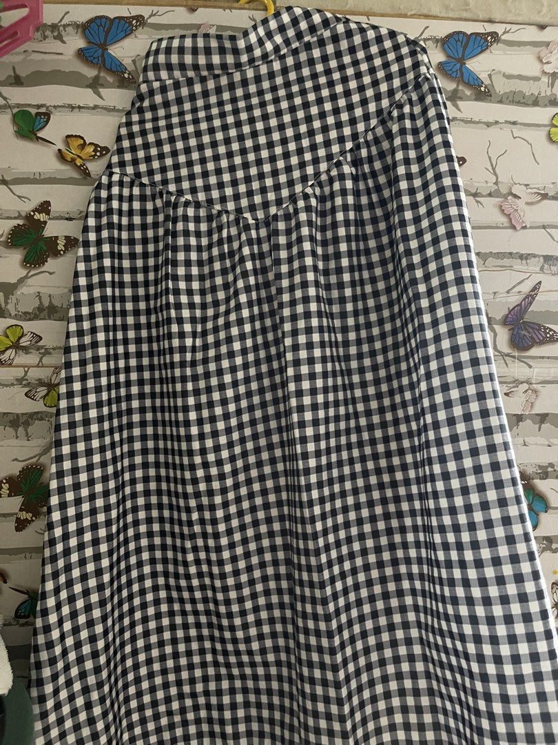 Black and White Gingham Checkered Midi Skirt (Category: Skirts) located in Manila. Submitted by mightyfire-1f1603 (Listing ID 1469289778, Image 1). Description: - Classic black and white gingham print - High-waisted fit with a structured yoke panel - Gathered lower half for a flowy silhouette - Lightweight, breathable fabric ideal for warm weather - Versatile piece, easy to pair with basic tees or blouses.