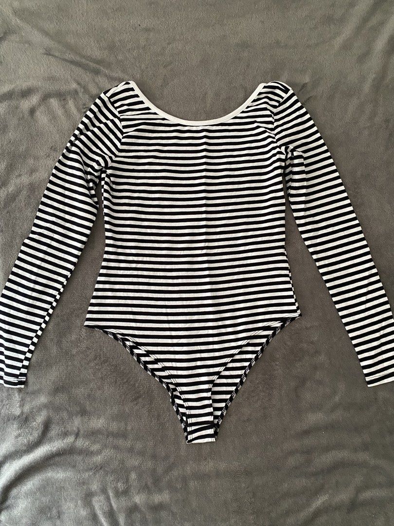 Black and White Striped Long Sleeve Bodysuit (Category: Longsleeves) located in Manila. Submitted by love_mami (Listing ID 1469170938, Image 1). Description: - Used once - Classic black and white horizontal stripe design - Long sleeves with a flattering scoop neckline - Trendy double-strap detail on the back - Convenient snap button closure at the bottom - Stretchy, super comfortable cotton blend fabric - Versatile piece, perfect for layering wit