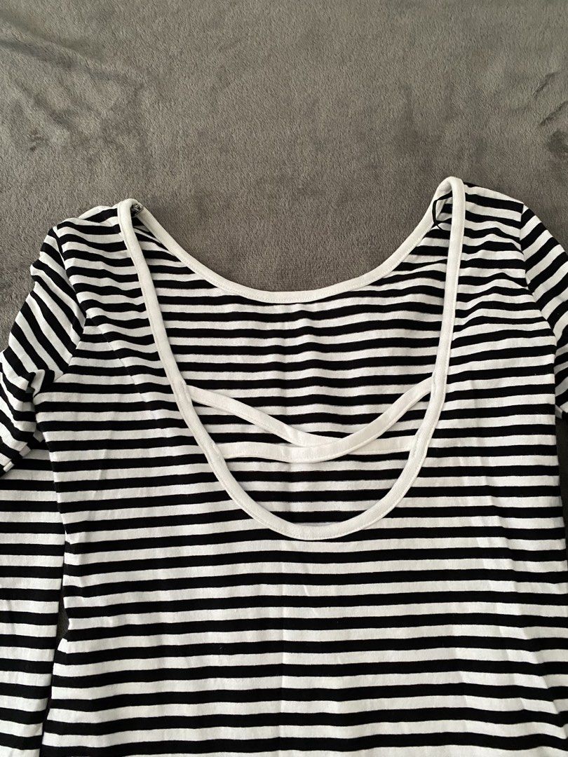 Black and White Striped Long Sleeve Bodysuit (Category: Longsleeves) located in Manila. Submitted by love_mami (Listing ID 1469170938, Image 2). Description: - Used once - Classic black and white horizontal stripe design - Long sleeves with a flattering scoop neckline - Trendy double-strap detail on the back - Convenient snap button closure at the bottom - Stretchy, super comfortable cotton blend fabric - Versatile piece, perfect for layering wit