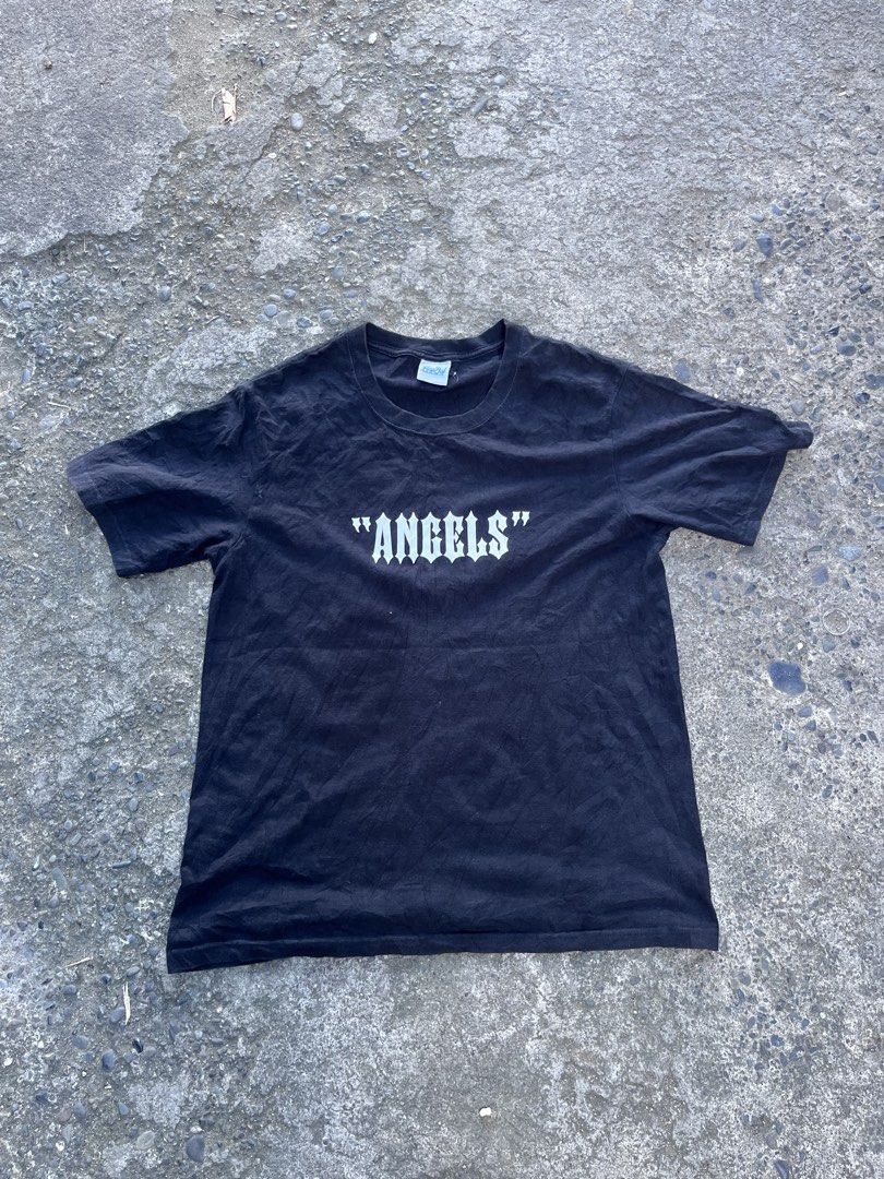 Black Angels Graphic T-Shirt (Category: Tshirts & Polo Shirts ) located in Manila. Submitted by coybns (Listing ID 1469187524, Image 1). Description: - Color: Black - Material: Heavy cotton - Fit: Standard fit with crew neck - Design: White gothic lettering on front; large white angel wings and matching gothic lettering on back - Style: Bold streetwear.