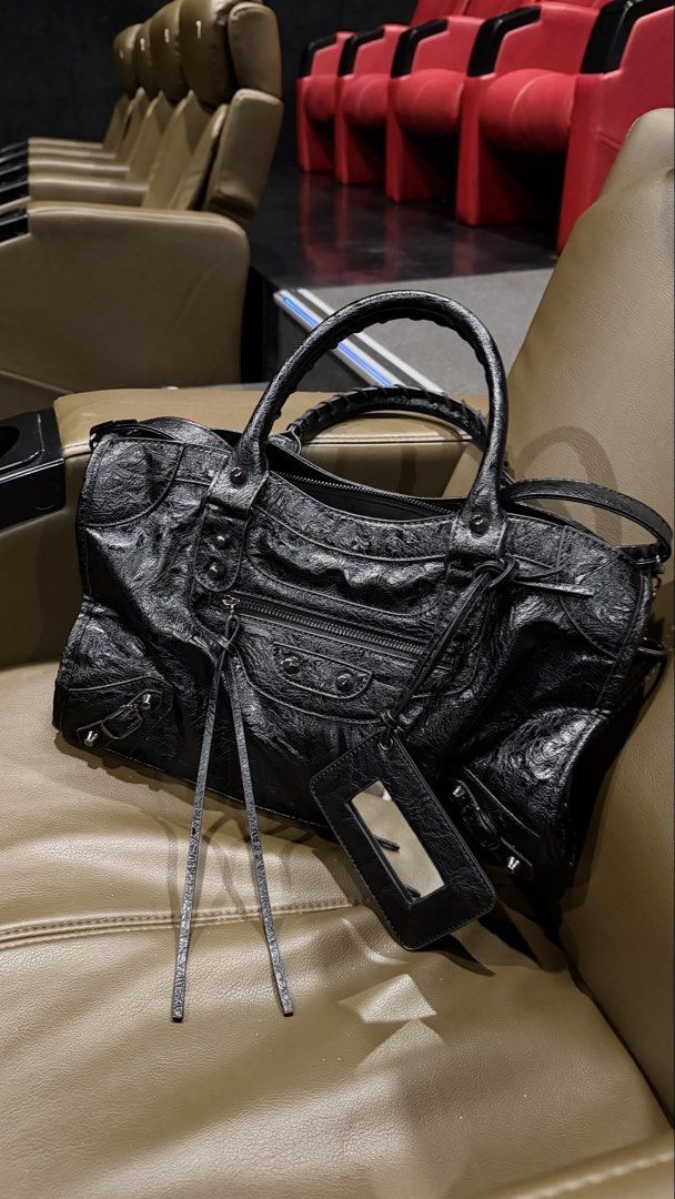 Black Balenciaga City Bag (Medium) (Category: Luxury Bags & Wallets) located in Manila. Submitted by originalbagsph (Listing ID 1469249095, Image 1). Description: Selling my brand-new Balenciaga City Bag Black with silver hardware Medium size (fits an iPad) In excellent condition Includes: Mirror and crossbody strap RFS: Used 4 times only. Negotiable .