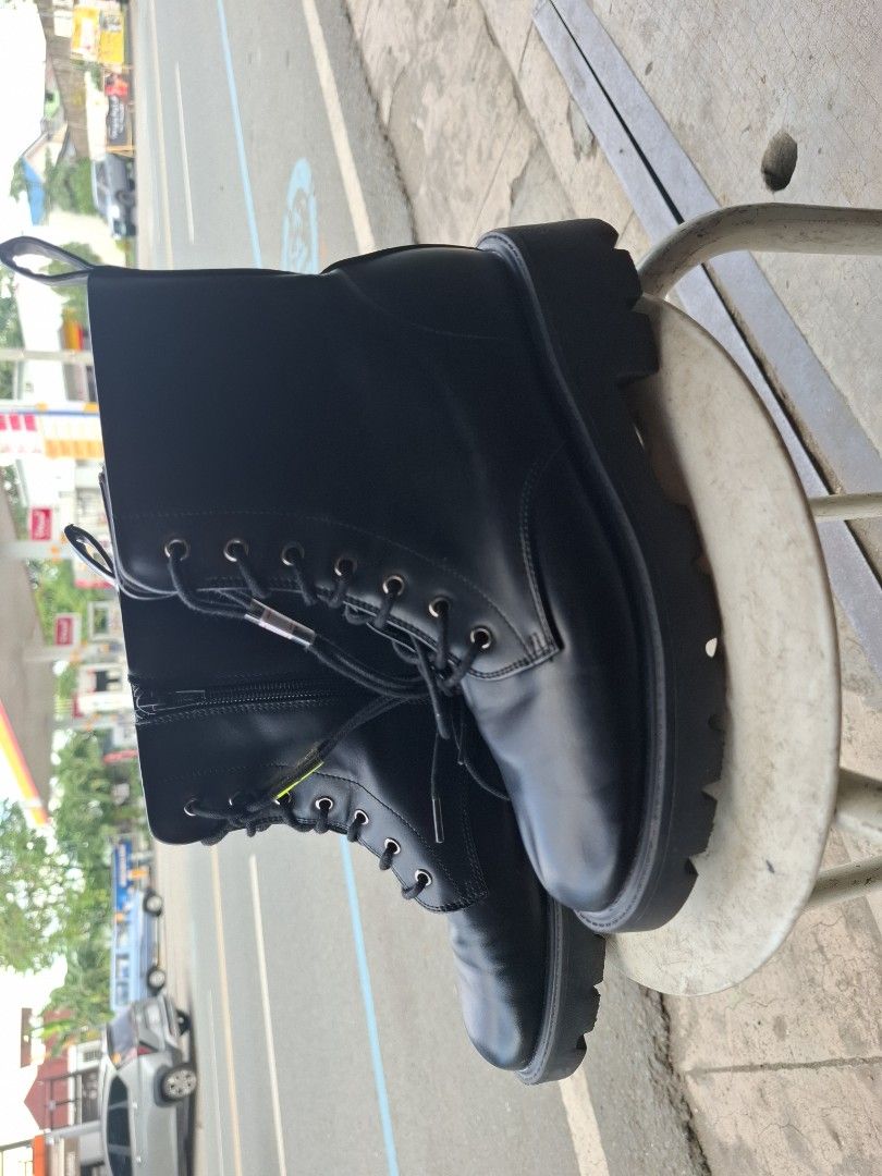 Black combat boots with side zipper and lug sole (Category: Boots) located in Manila. Submitted by rocksolid227 (Listing ID 1469202194, Image 2). Description: - Color: Black - Closure: Lace-up front with easy side zippers - Soles: Chunky lug soles for superior grip - Design: High-top with a clean, smooth finish and back pull loop - Style: Perfect for casual outings or edgy outfits.
