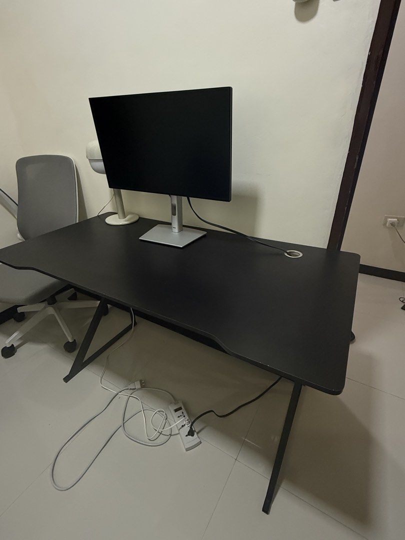 Black Computer Desk with Metal Z-Frame (Category: Office Furniture & Fixtures) located in Manila. Submitted by jooliyen (Listing ID 1469279401, Image 1). Description: - Color: Black -DIMENSION/SUKAT: (120cm x 60cm) - Frame: Sturdy metal Z-shaped legs for maximum stability - Features: Built-in cable management grommet hole - Condition: Smooth tabletop with minor edge wear from normal use - Ideal for: Work-from-home setups, dual monitors, or gaming