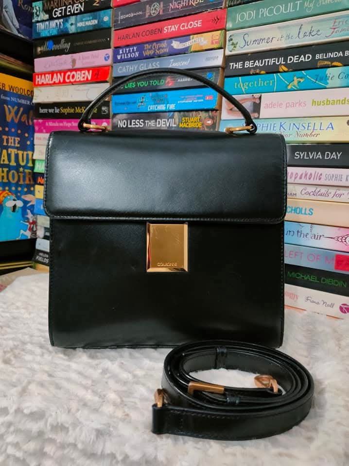 Black Leather Handbag with Gold Clasp and Strap (Category: Luxury Bags & Wallets) located in Manila. Submitted by ekailacerna (Listing ID 1469317193, Image 1). Description: - Classic black leather handbag with a structured boxy shape - Elegant gold metal clasp on the front flap - Includes a matching detachable shoulder strap with gold hardware - Smooth leather finish with a clean interior space - Versatile everyday bag that fits all your daily es
