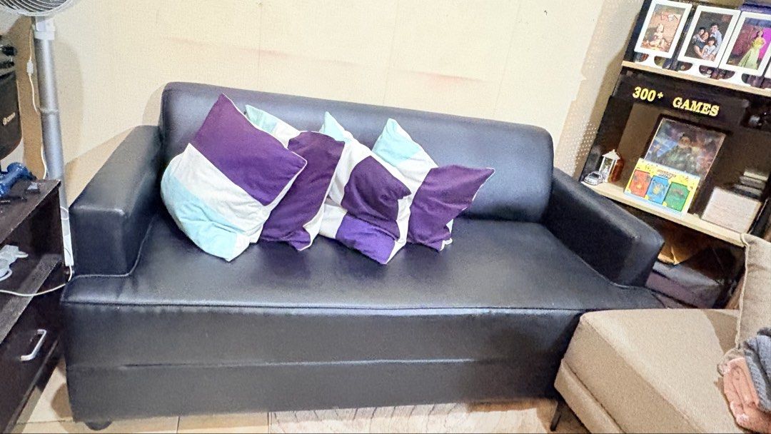 Black Leather Sofa (Throw Pillows not included) (Category: Sofas) located in Pasig City. Submitted by prettyoldsoul (Listing ID 1469177074, Image 3). Description: - Type: 3-Seater Sofa - Material: Easy-to-maintain black faux leather - Condition: good as new, Clean, well-kept - Features: Sturdy armrests on both sides - Best for: Living room or office space.