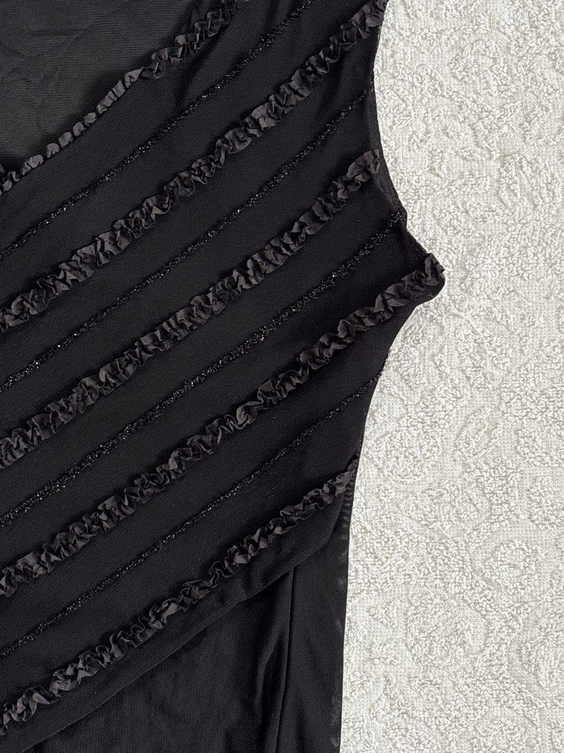 Black Mesh Sleeveless Top with Diagonal Ruffle Details (Category: Sleeveless) located in Butuan. Submitted by saloreia (Listing ID 1469296152, Image 2). Description: ── ⟡ ˙💌 ̟ midnight embellished top ‧₊˚ ⋅ a sleek black silhouette with diagonal beaded details ‧₊˚ ⋅ ┆ ⤿ brand : none ┆ ⤿ size : XS–S (stretchable) 🪷 condition .ᐟ: check comment for issue.