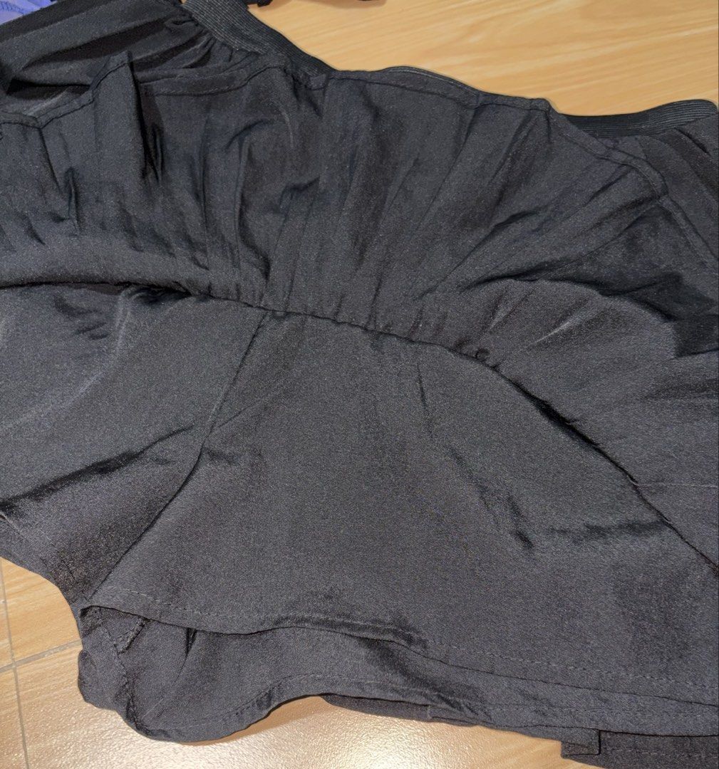 Black Pleated Layered Skort (Category: Skirts) located in Caloocan City. Submitted by stella_mari27 (Listing ID 1469227370, Image 3). Description: - Color: Black - Style: Pleated tiered skort - Comfort: Built-in shorts for worry-free wear - Waistband: Stretchy elastic for a comfortable fit - Fabric: Lightweight and easy to move in - Versatility: Great basic piece to match with simple tees or crop tops for casual days out.