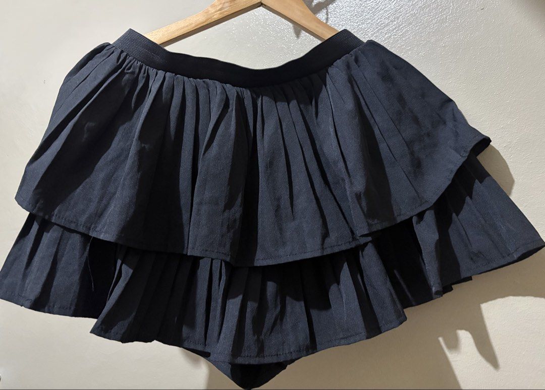 Black Pleated Layered Skort (Category: Skirts) located in Caloocan City. Submitted by stella_mari27 (Listing ID 1469227370, Image 1). Description: - Color: Black - Style: Pleated tiered skort - Comfort: Built-in shorts for worry-free wear - Waistband: Stretchy elastic for a comfortable fit - Fabric: Lightweight and easy to move in - Versatility: Great basic piece to match with simple tees or crop tops for casual days out.