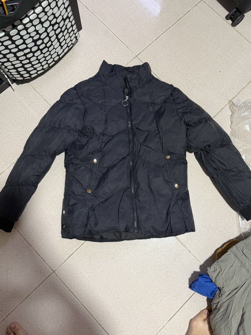 Black Quilted Puffer Winter Jacket (Category: Coats, Jackets and Outerwear) located in Quezon City. Submitted by wonderrv18 (Listing ID 1469184773, Image 1). Description: - Color: Classic black - Design: Quilted puffer jacket with a high collar - Closure: Full zip front with a chic ring pull zipper - Details: Metallic snap button accents on the pockets and sides - Comfort: Ribbed cuffs to keep the cold out and trap warmth - Condition: Great piece