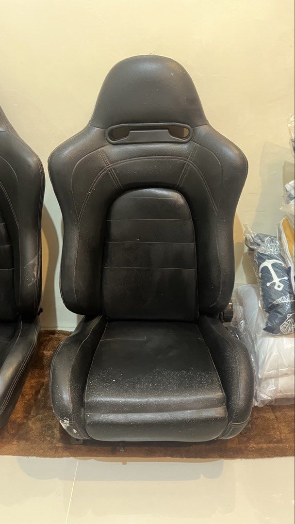 Black Racing Bucket Seats Pair (Category: Upholstery, Seatcovers and Other Interior Parts and Accessories) located in Binan City. Submitted by eva.unit.07 (Listing ID 1469169065, Image 2). Description: For Sale / Swap Aftermarket Reclinable Seats (Recaro SR5 Copy) 2pcs / Pair Specs: • Polyethylene construction with custom leather upholster. High-back bucket/semi-bucket shape with integrated harness/belt pass-through openings near the shoulders. •