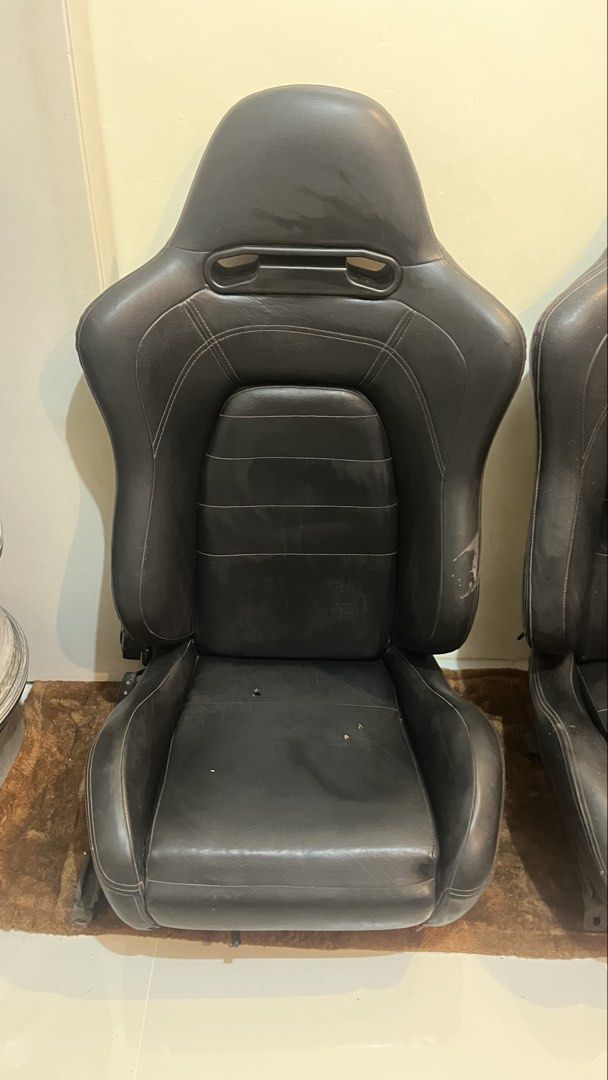 Black Racing Bucket Seats Pair (Category: Upholstery, Seatcovers and Other Interior Parts and Accessories) located in Binan City. Submitted by eva.unit.07 (Listing ID 1469169065, Image 3). Description: For Sale / Swap Aftermarket Reclinable Seats (Recaro SR5 Copy) 2pcs / Pair Specs: • Polyethylene construction with custom leather upholster. High-back bucket/semi-bucket shape with integrated harness/belt pass-through openings near the shoulders. •