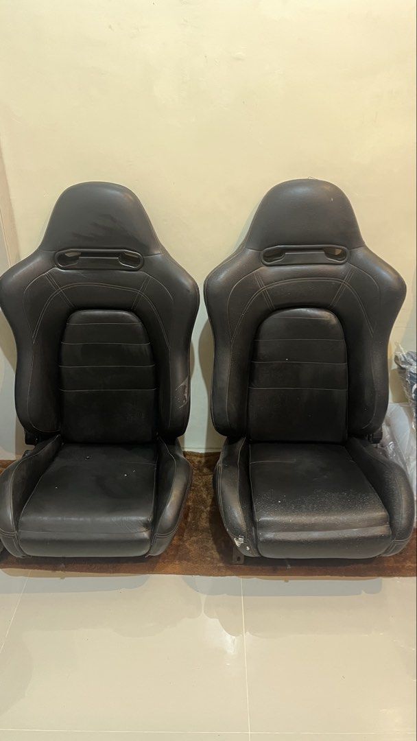Black Racing Bucket Seats Pair (Category: Upholstery, Seatcovers and Other Interior Parts and Accessories) located in Binan City. Submitted by eva.unit.07 (Listing ID 1469169065, Image 1). Description: For Sale / Swap Aftermarket Reclinable Seats (Recaro SR5 Copy) 2pcs / Pair Specs: • Polyethylene construction with custom leather upholster. High-back bucket/semi-bucket shape with integrated harness/belt pass-through openings near the shoulders. •