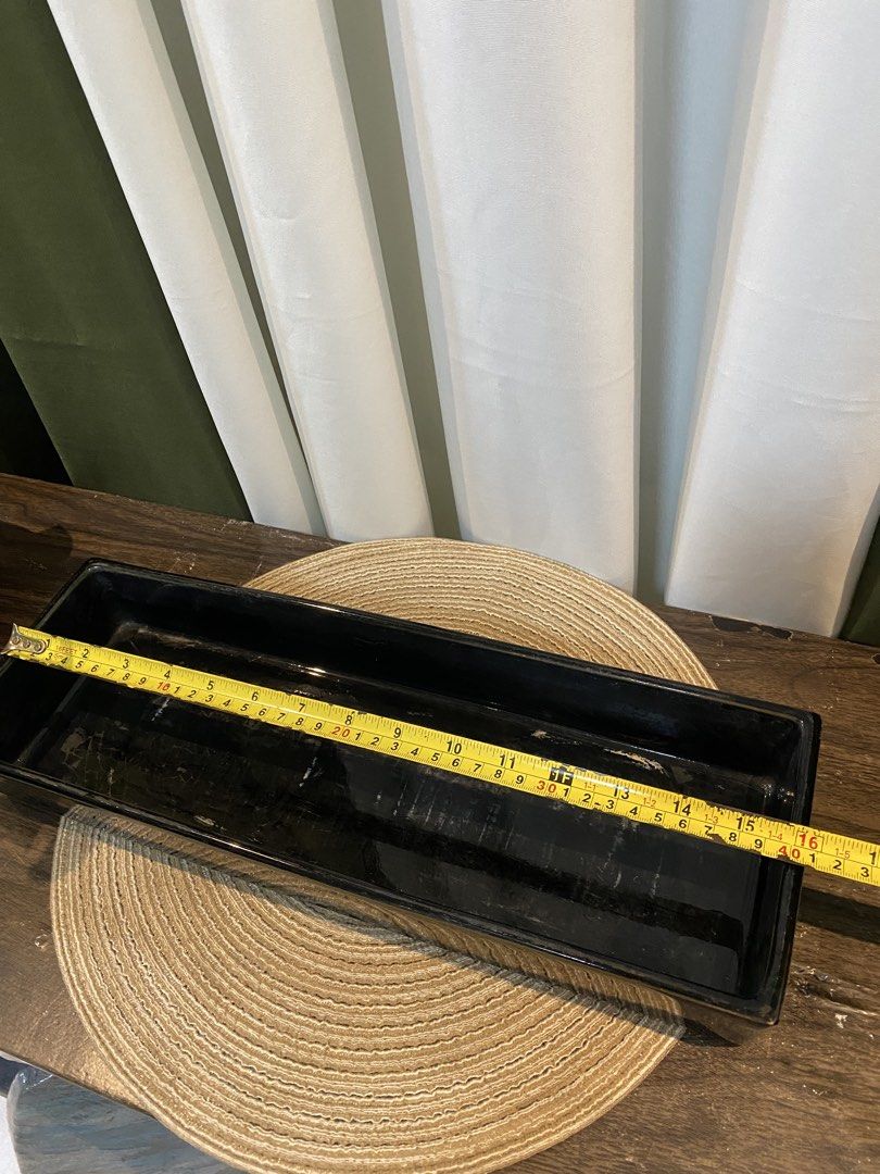 Black Rectangular Plant Pot Tray Long Planter Box (Category: Pots & Planters) located in San Pedro. Submitted by jingay81 (Listing ID 1469380017, Image 1). Description: - Product: Black rectangular planter box - Ideal for: Indoor plants, herbs, succulents, flowers, or seed starting - Dimensions: Roughly 16 inches long by 4 inches deep - Finish: Sleek glossy black - Condition: Sturdy and functional with minor scuffs and marks inside from previous 