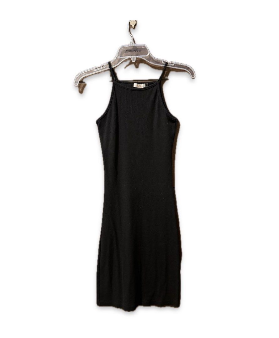 Black Ribbed Body con Dress Size 6 (Category: Dresses) located in Quezon City. Submitted by ianne.declutter (Listing ID 1452813449, Image 2). Description: - Brand: Chicabooti - Style: Black ribbed mini dress - Features: Spaghetti straps, high neckline - Material: Stretchy - Measurements: Approx. 12 inches (chest), 32 inches (length) - Versatility: Great for layering or wearing on its own Stretchy material.