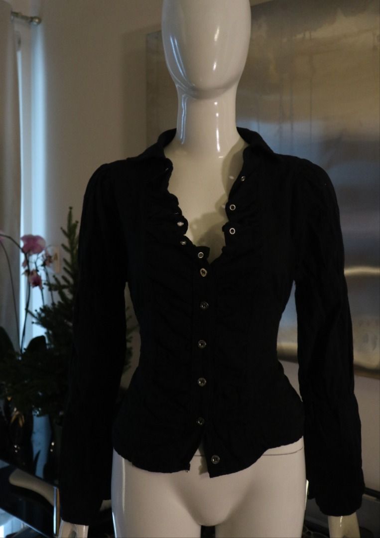 Black Ruffled Long Sleeve Button Down Shirt (Category: Longsleeves) located in Paranaque City. Submitted by skulkch (Listing ID 1469362210, Image 1). Description: - Color: Black - Style: Button-down blouse with ruffled lapels - Details: Silver-tone front buttons, long sleeves, fitted cut - Versatility: Perfect for casual or formal wear - Condition: Excellent / Well-maintained.
