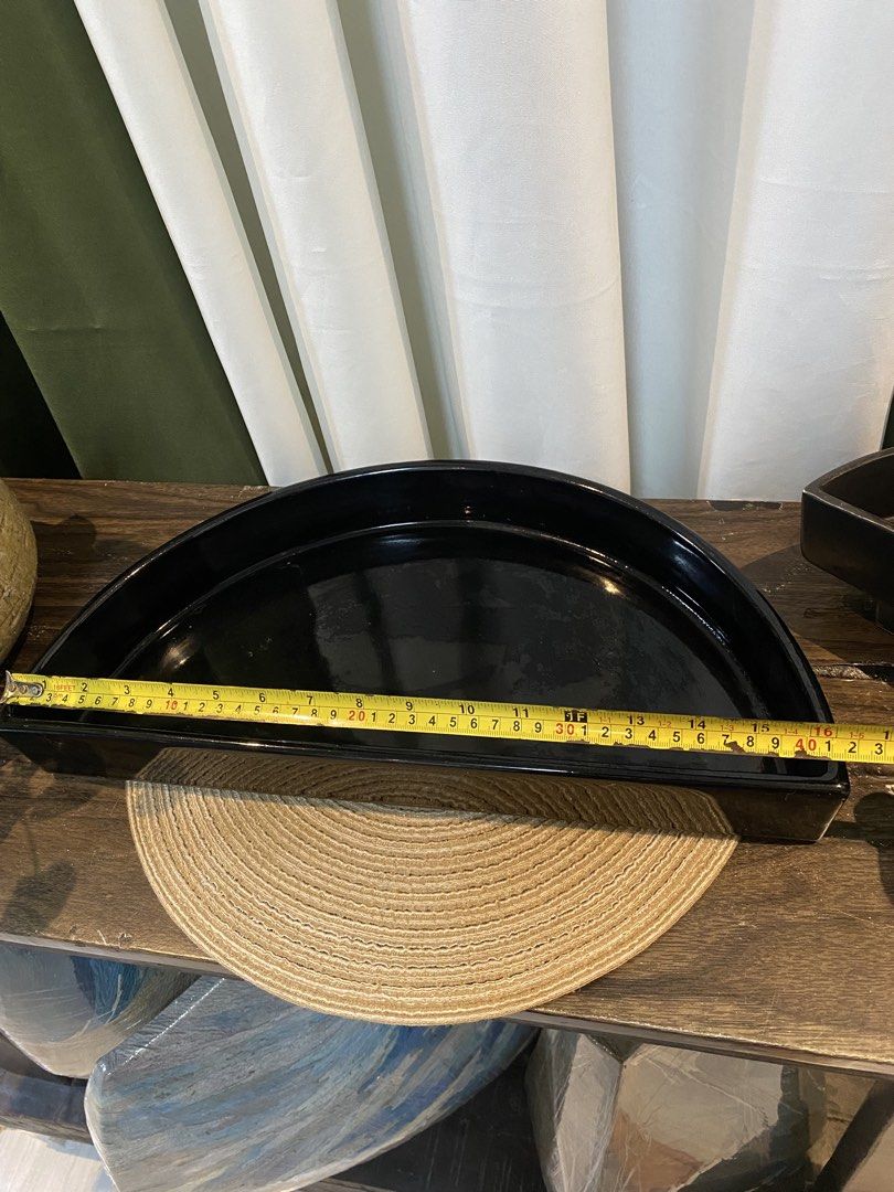Black semicircular decorative tray ceramic dish (Category: Dinnerware & Cutlery) located in San Pedro. Submitted by jingay81 (Listing ID 1469375539, Image 3). Description: - Half-circle black ceramic tray with a sleek glossy finish - Generous 16-inch width, ideal for console or coffee tables - Flat base with raised curved edges to keep items secure - Versatile use: perfect for holding small decor, candles, or vanity essentials - Solid black desig