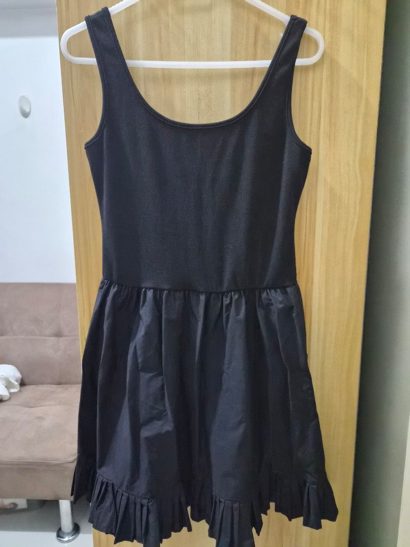 Black sleeveless dress with ruffled hem (Category: Dresses) located in Mandaluyong City. Submitted by joyce1593 (Listing ID 1469254748, Image 3). Description: - Style: Black sleeveless dress with a scoop neckline - Top: Fitted ribbed knit - Skirt: Flowy with a playful ruffled hem - Condition: Excellent - Perfect for: Casual day out, brunch, or casual dates ***belt not included and sold separately.