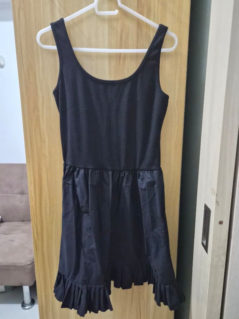 Black sleeveless dress with ruffled hem (Category: Dresses) located in Mandaluyong City. Submitted by joyce1593 (Listing ID 1469254748, Image 1). Description: - Style: Black sleeveless dress with a scoop neckline - Top: Fitted ribbed knit - Skirt: Flowy with a playful ruffled hem - Condition: Excellent - Perfect for: Casual day out, brunch, or casual dates ***belt not included and sold separately.