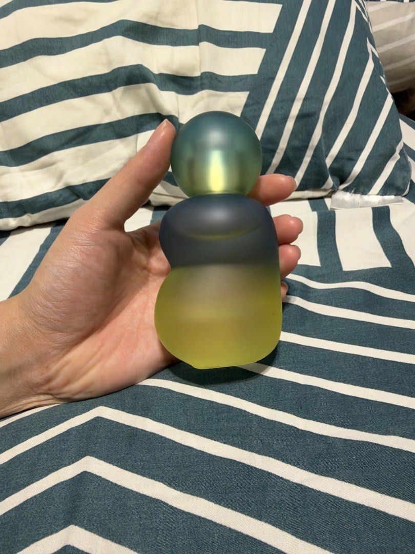 blk Cosmetics Fragrance Mist Perfume (Category: Fragrance & Deodorants) located in Manila. Submitted by garagesalebykoda (Listing ID 1469164606, Image 2). Description: - Authentic blk cosmetics perfume bottle - Unique asymmetrical glass design with a frosted green, blue, and yellow gradient - Compact and easy-to-hold size - Features a minimalist embossed blk logo on the lower front - Fun and quirky vanity decor piece.