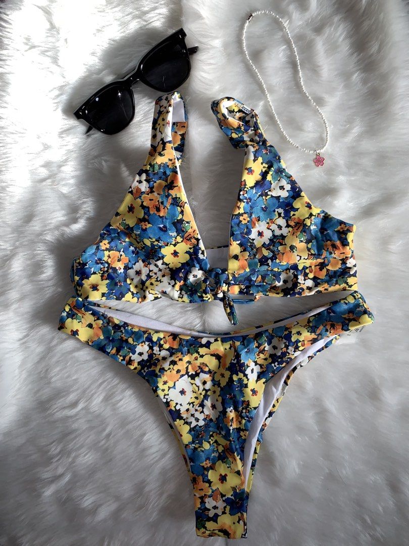 Blue and Yellow Floral Two-Piece Bikini Set (Category: Bikinis & Swimsuits) located in Mandaluyong City. Submitted by gentle.segoviajam (Listing ID 1469324296, Image 1). Description: - Style: Floral two-piece swimsuit (blue, yellow, and white flowers) - Top: Halter style with a trendy front tie knot - Bottoms: Flattering high-cut leg design - Lining: Soft white inner lining on both top and bottom - Condition: Impeccably clean, zero flaws, and rea