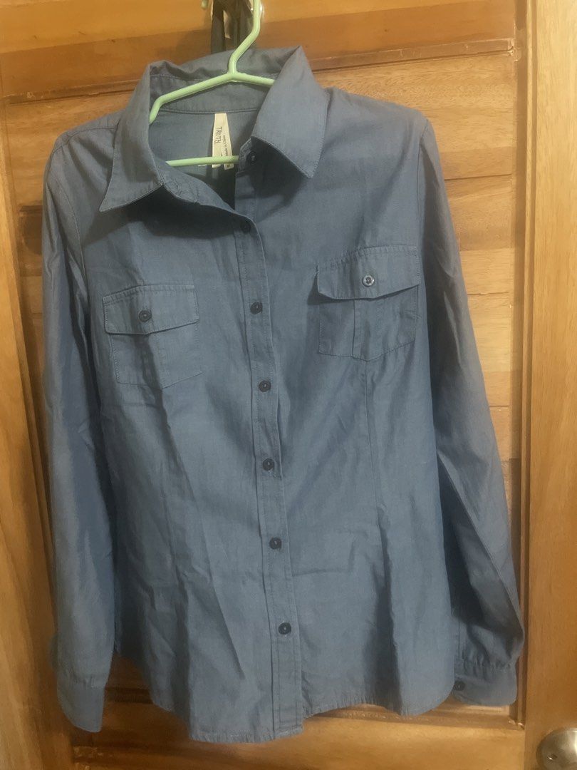 Blue Button-Up Long Sleeve Shirt with Pockets (Category: Longsleeves) located in Dumaguete. Submitted by han_heuinanta (Listing ID 1469245363, Image 1). Description: - Color: Slate Blue - Style: Long-sleeve button-up with classic collar - Details: Dual chest pockets, dark buttons on front and cuffs - Fabric: Lightweight and comfortable - Meetup or shipping options available (DM to order).