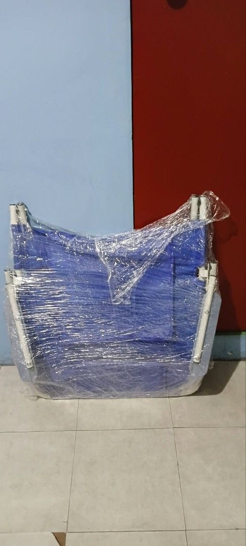 Blue Folding Back Rest (Category: Bed Frames & Mattresses) located in Manila. Submitted by anthonylee23810 (Listing ID 1469232343, Image 1). Description: - Color: Blue with a sturdy white metal frame - Compact & Portable: Folds tightly for easy storage in a closet or car trunk - Versatile Use: Great for overnight guests, camping trips, or office naps - Condition: Wrapped tightly in plastic film for safe storage and transport.