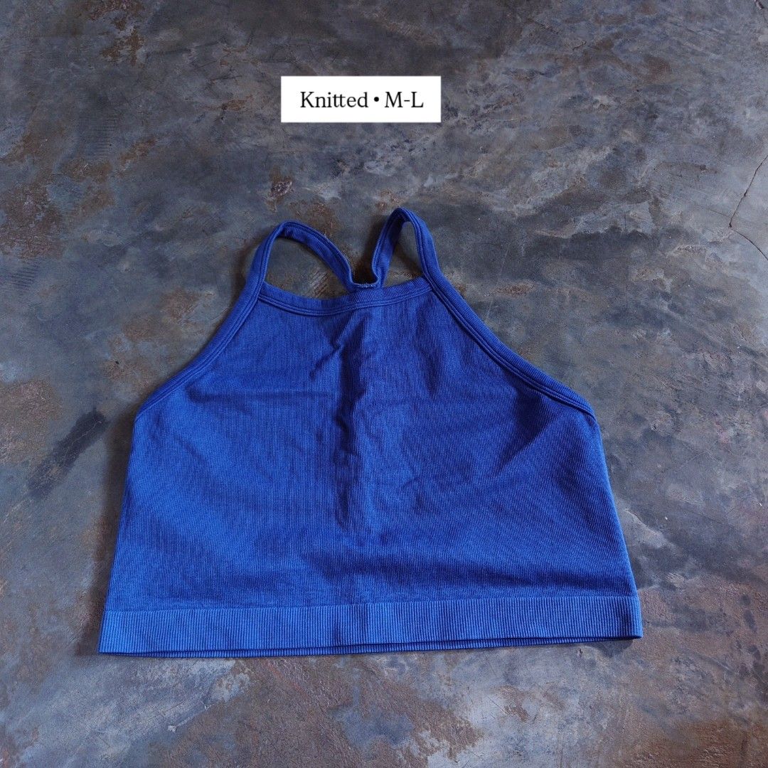 Blue Knitted Crop Top M-L (Category: Sleeveless) located in Diffun. Submitted by declutteredbyJill (Listing ID 1469238545, Image 1). Description: - Color: Bright blue - Size: M-L - Design: Racerback with trendy criss-cross back straps - Texture: All-over ribbed knit with a secure bottom hem band - Material: Super comfortable and stretchy fabric - Styling: Great basic piece for layering or wearing on its own.