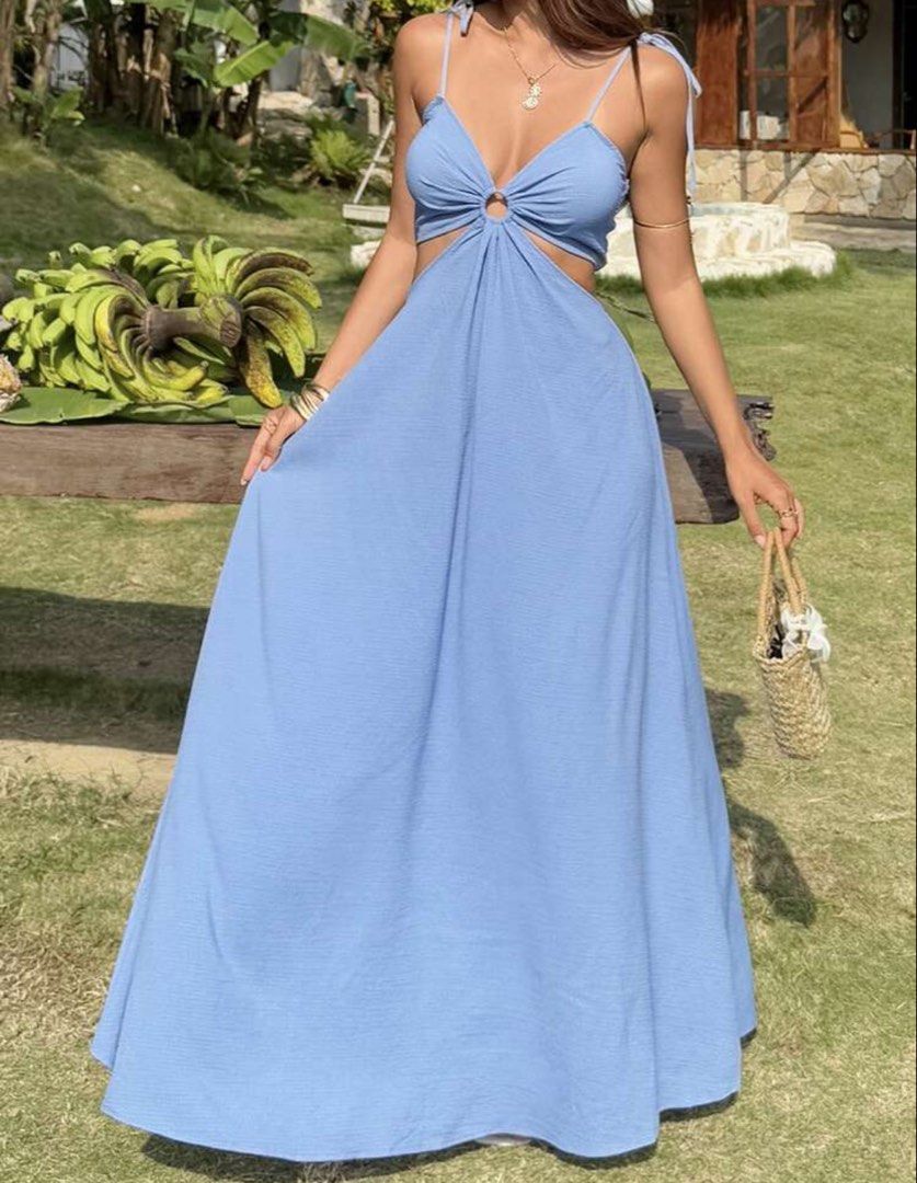 Blue maxi dress (Category: Dresses) located in Taguig. Submitted by ls_ln (Listing ID 1469194802, Image 1). Description: - Color: Light blue - Size: XS-S - Style: Maxi dress with long flowing skirt - Details: Tie straps, O-ring center front, side cut-outs, and open back - Fit: Comfortable smocked back band - Ideal for: Vacations, beach trips, and warm weather days.
