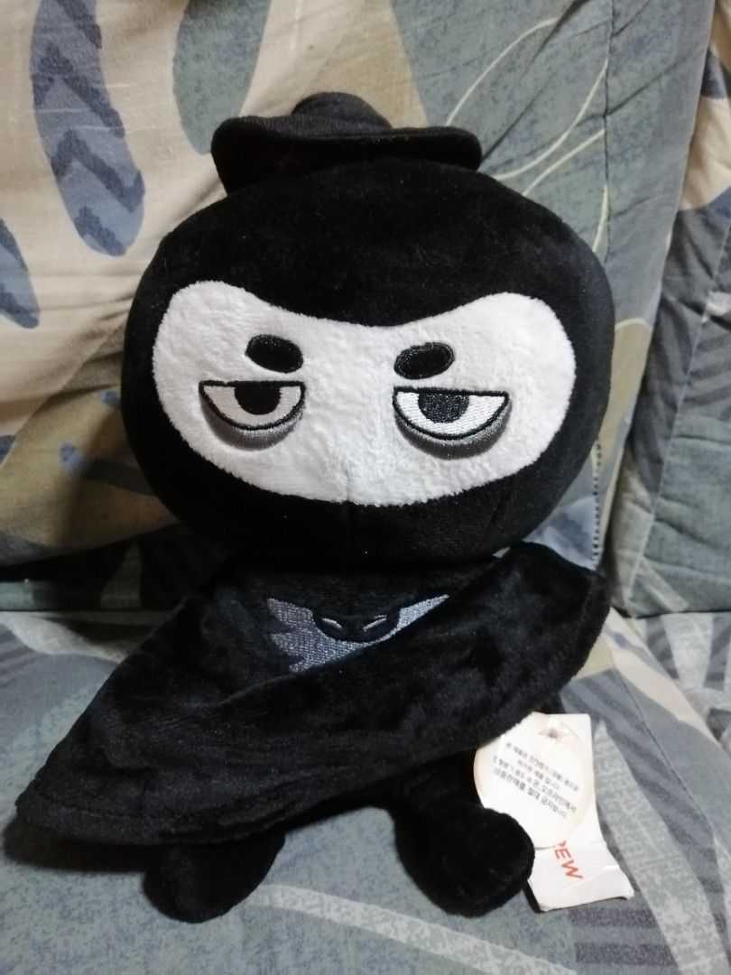 BoniCrew Plush Toy Set (Category: Plushies & Soft Toys) located in Angono. Submitted by rlinee_93 (Listing ID 1469213574, Image 3). Description: Two plushies from BoniCrew. One light brown character wearing a hooded outfit with pink cheeks and a small brown curl on top. Second character dressed in a black ninja or superhero costume with a mask, sleepy eyes, and a winged logo on the chest. Both have original tags attached. Soft fabric, clean condi