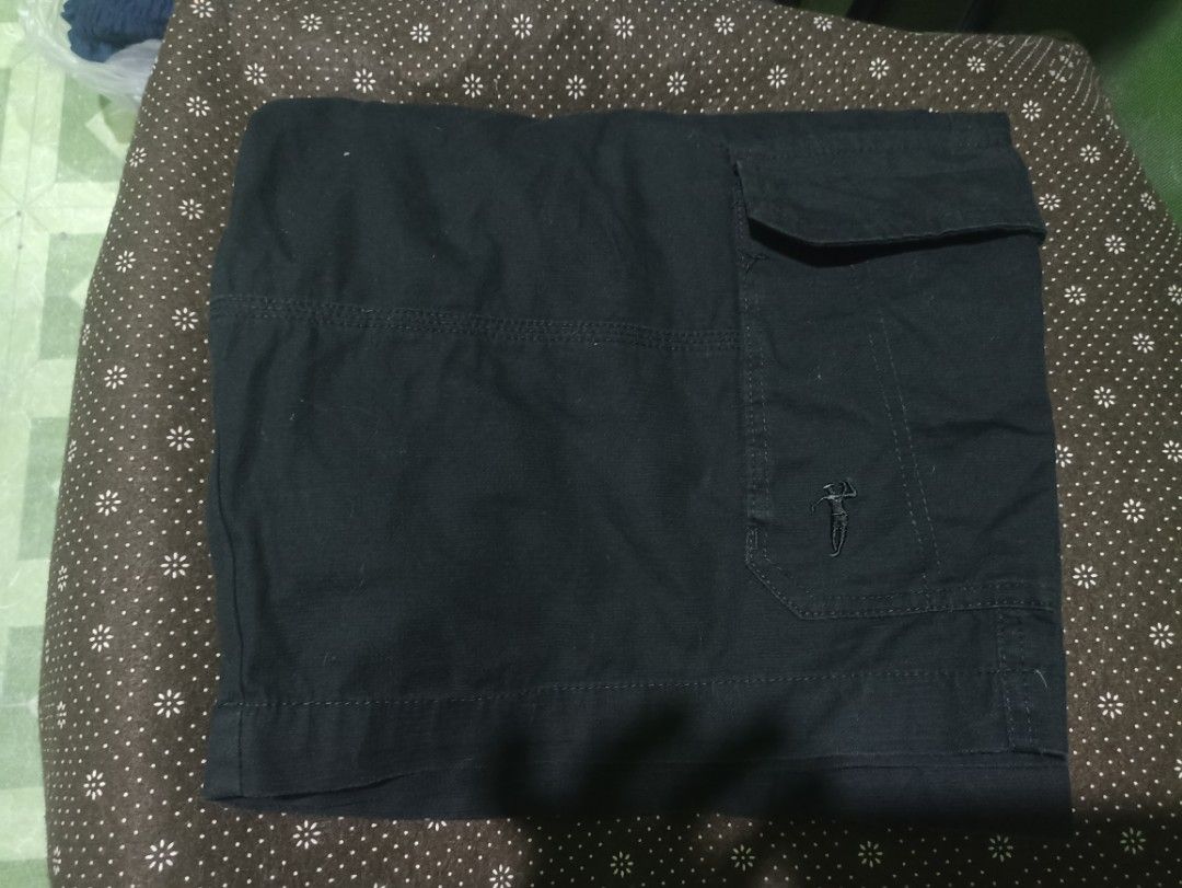 Bossini Black Cargo Shorts Size 42 on tag (Category: Shorts) located in Tarlac. Submitted by allinoneshop2178 (Listing ID 1469244128, Image 3). Description: - Brand: Bossini(6pockets) - Color: Classic Black - Size: 42(MEDIDA size 44) length:25inch - Material: Sturdy, durable cotton - Features: Multiple side and back pockets, branded button closure, small logo embroidery - Condition: Clean and ready to wear - Style: Perfect for daily casual use.