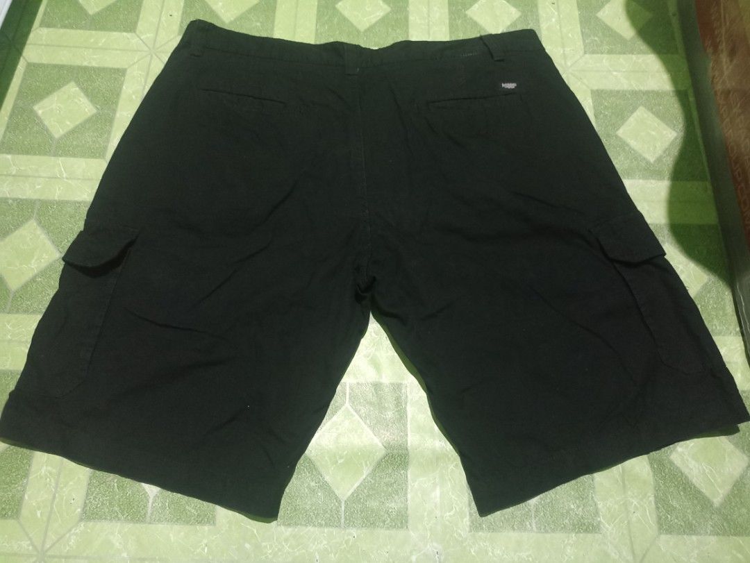 Bossini Black Cargo Shorts Size 42 on tag (Category: Shorts) located in Tarlac. Submitted by allinoneshop2178 (Listing ID 1469244128, Image 2). Description: - Brand: Bossini(6pockets) - Color: Classic Black - Size: 42(MEDIDA size 44) length:25inch - Material: Sturdy, durable cotton - Features: Multiple side and back pockets, branded button closure, small logo embroidery - Condition: Clean and ready to wear - Style: Perfect for daily casual use.