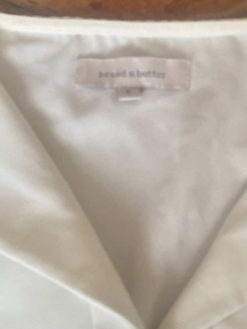 Bread n Butter White Long Sleeve Blouse (Category: Longsleeves) located in Manila. Submitted by bravecloud.304b93 (Listing ID 1469180885, Image 2). Description: - Brand: Bread n Butter - Color: Clean solid white - Style: Long sleeve blouse with foldover collar - Details: Single front button closure and button cuffs - Material: Smooth, comfortable fabric - Condition: Excellent wardrobe staple, perfect for office wear or casual outings.