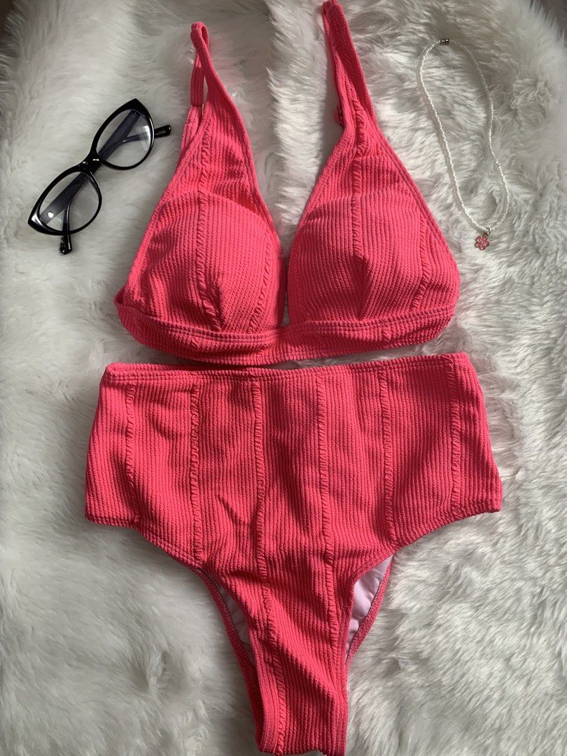 Bright Pink Ribbed High-Waisted Bikini Set (Category: Bikinis & Swimsuits) located in Mandaluyong City. Submitted by gentle.segoviajam (Listing ID 1469325280, Image 1). Description: - Color: Hot Pink - Material: Textured ribbed fabric (clean, sturdy, zero signs of wear) - Style: Halter neck top with high-waisted bottoms - Coverage: Full coverage - Condition: Brand new without tags, never worn - Ideal for: Beach days, pool lounging, and vacations.