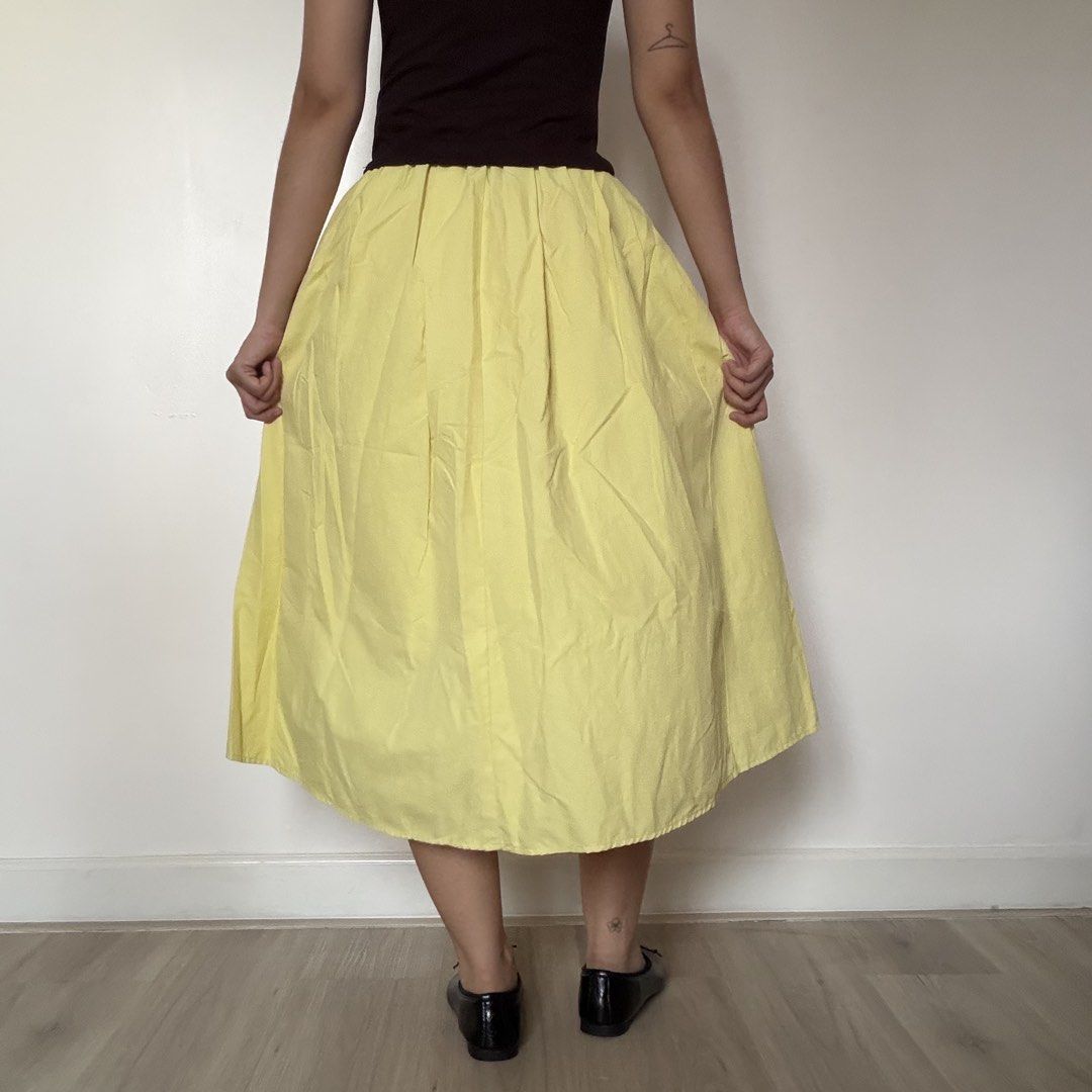 Bright Yellow Pleated Midi Skirt (Category: Skirts) located in Quezon City. Submitted by shop_imdari (Listing ID 1469165382, Image 3). Description: Waist 24-27” garterized Hips 42” Length 27” .