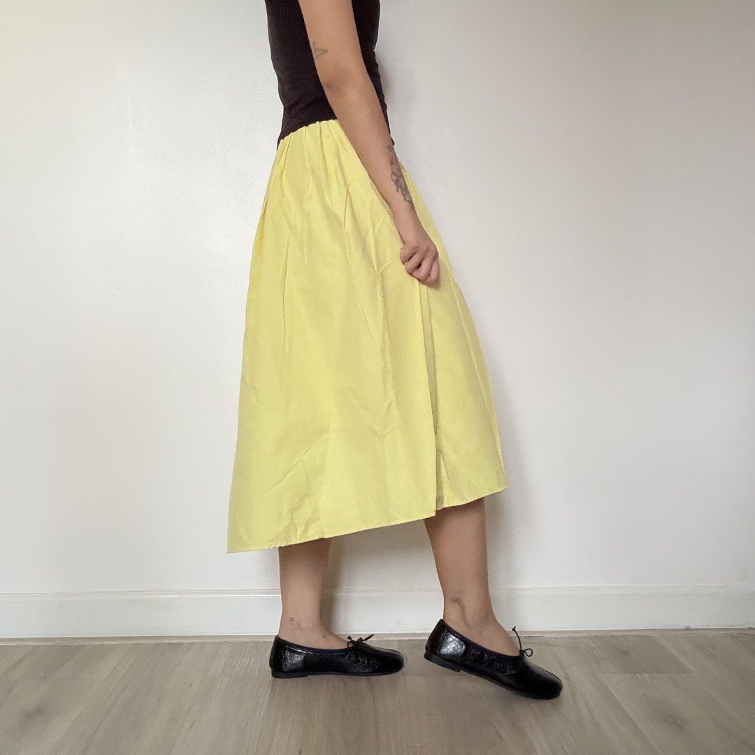 Bright Yellow Pleated Midi Skirt (Category: Skirts) located in Quezon City. Submitted by shop_imdari (Listing ID 1469165382, Image 2). Description: Waist 24-27” garterized Hips 42” Length 27” .
