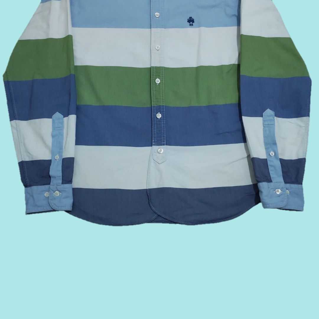 Brooks Brothers Red Fleece Striped Button Down Shirt (Category: Formal Shirts) located in Tarlac. Submitted by senkustuff (Listing ID 1469184521, Image 3). Description: - Brand: Brooks Brothers Red Fleece - Size: Medium (M) - Design: Bold horizontal stripes in blue, green, white, and dark blue - Details: Iconic embroidered golden fleece logo with 1818 detail on the chest - Accents: Contrast light blue collar and button cuffs Dimes Length:29.5 Wid