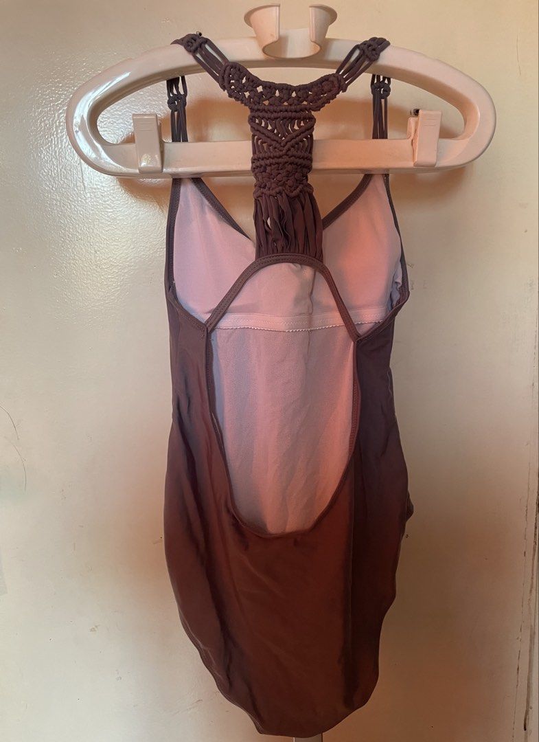 Brown One-Piece Swimsuit with Macrame Back Detail (Category: Bikinis & Swimsuits) located in Manila. Submitted by zzjjm (Listing ID 1469215939, Image 2). Description: - Color: gray - Design: Deep scoop front and low scoop back - Details: Intricate macrame strap detailing on the back - Support: Built-in shelf bra padding - Material: Smooth, comfortable fabric.