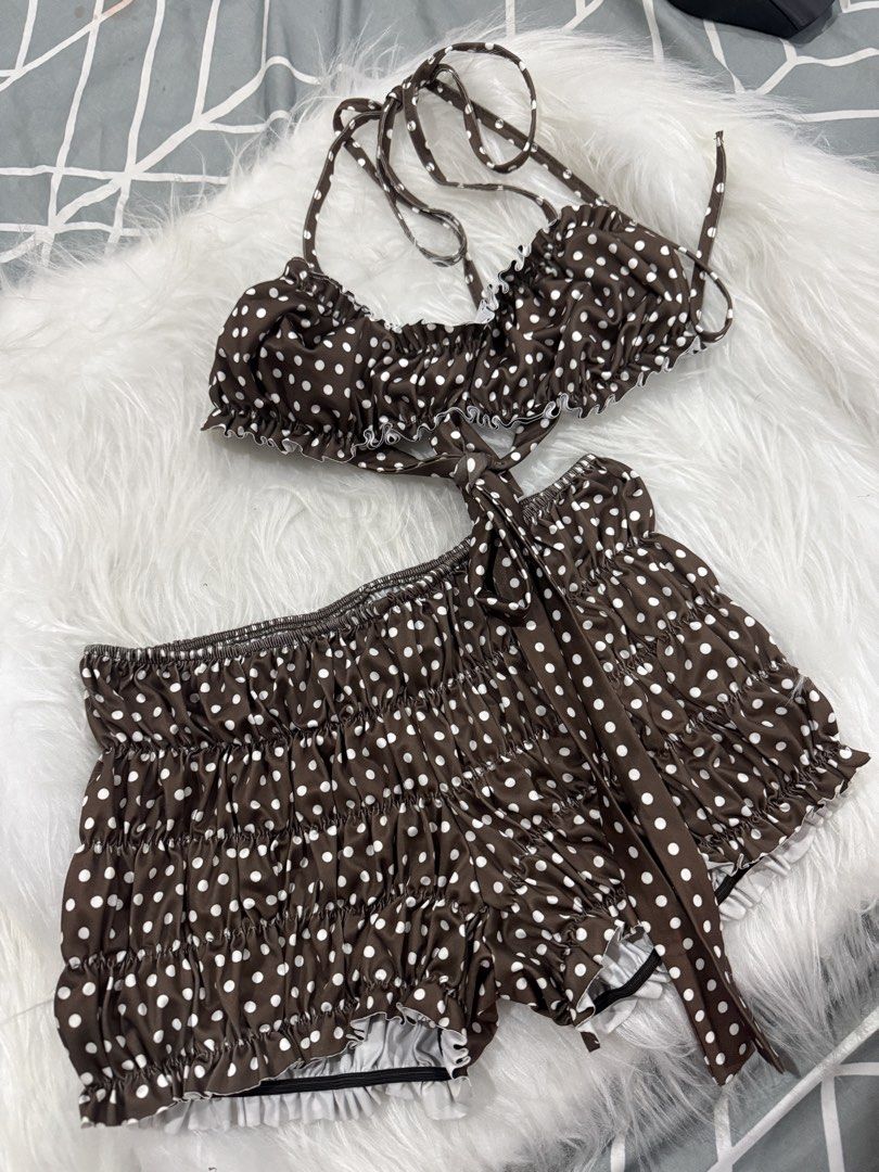 Brown Polka Dot Ruffle Two Piece Set (Category: Bikinis & Swimsuits) located in Las Pinas. Submitted by juls_mp (Listing ID 1469330510, Image 1). Description: - Style: Brown two-piece set with white polka dots - Top: Halter neck tie with cute ruffle trim - Bottoms: Matching shorts with heavy shirring, elastic waistband, and tie string - Fit & Fabric: Super stretchy with a white lining underneath - Condition: Worn once or twice, excellent and clea