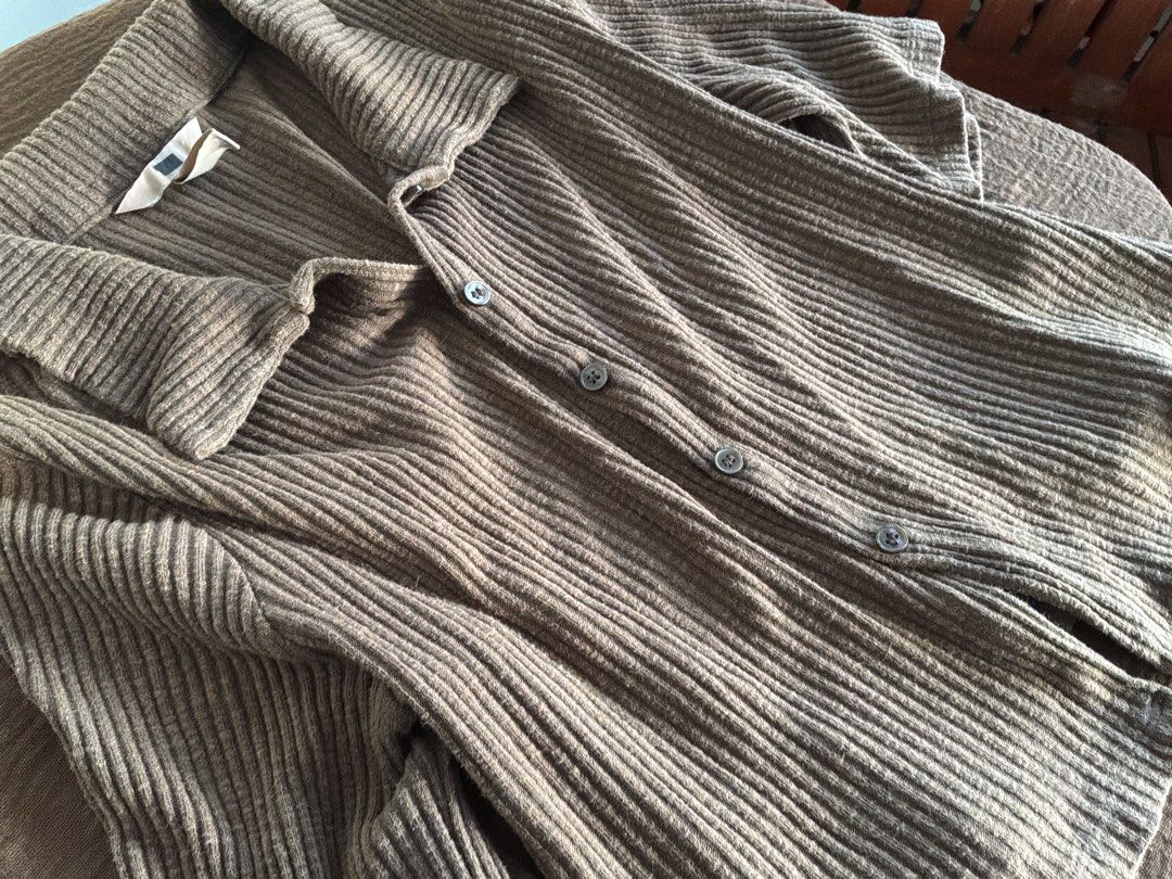 Brown Ribbed Collared Cardigan with Buttons (Category: Coats, Jackets and Outerwear) located in Dumaguete. Submitted by _l1lyy_ (Listing ID 1469245066, Image 2). Description: - Color: Brown - Style: Polo collar cardigan with front button closure - Sleeves: Half sleeves - Fit: Relaxed fit through the body - Details: Textured vertical ribbing on front and back.