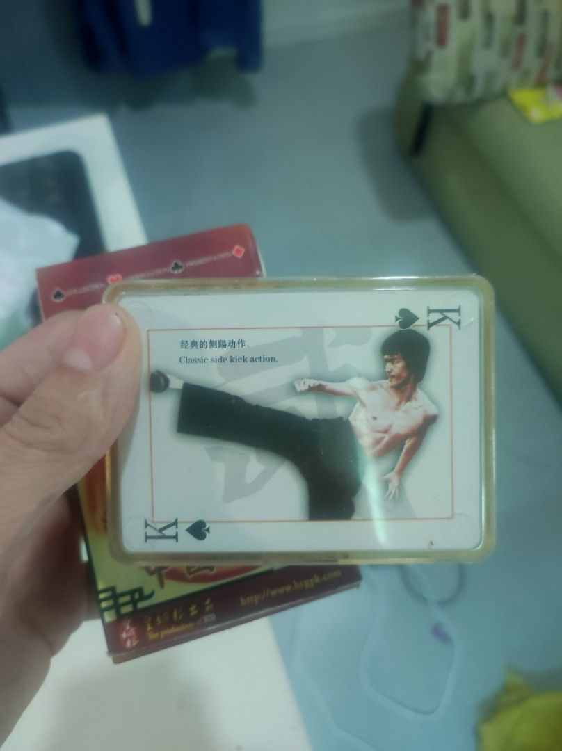 Bruce Lee Playing Cards Deck (Category: Board Games & Puzzles) located in Pasay City. Submitted by wizemindz138970 (Listing ID 1469367716, Image 2). Description: - Theme: Chinese Kung Fu featuring iconic Bruce Lee imagery - Design: Custom artwork on face cards with classic martial arts poses and photo collages on the back - Inclusion: Comes with a sturdy plastic protective storage case - Condition: Standard deck with original production details a