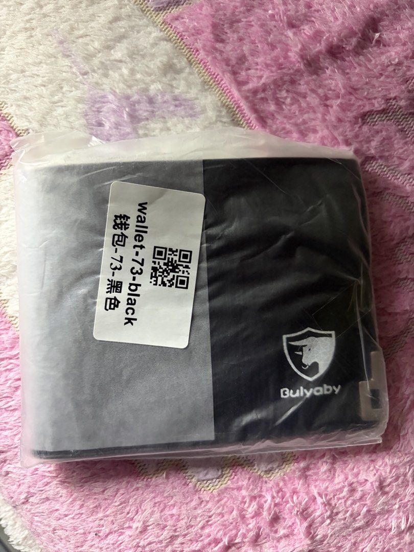 Bulyaby Wallet Black (Category: Wallets & Card holders) located in Quezon City. Submitted by jhosa888 (Listing ID 1469199228, Image 1). Description: - Brand: Bulyaby - Model: 73 - Color: Solid Black - Design: Standard bi-fold with front lower shield and bull logo - Condition: Brand new, still sealed in original plastic packaging with barcode label - Authenticity: Unopened and untouched since delivery.