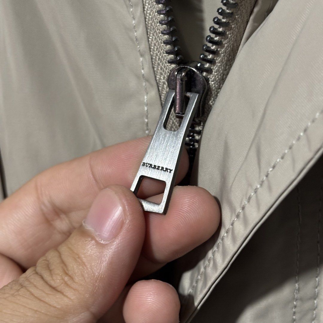 Burberry Brit Beige Hooded Jacket (Category: Coats, Jackets and Outerwear) located in Caloocan City. Submitted by bonsatocha43876 (Listing ID 1469323187, Image 2). Description: - Authentic Burberry Brit hooded jacket in classic beige - Brand new with complete tags attached - Features multiple front pockets with secure snap buttons - Premium branded hardware details - Iconic signature check pattern lining - Width: 24 inches - Length: 31 inches.
