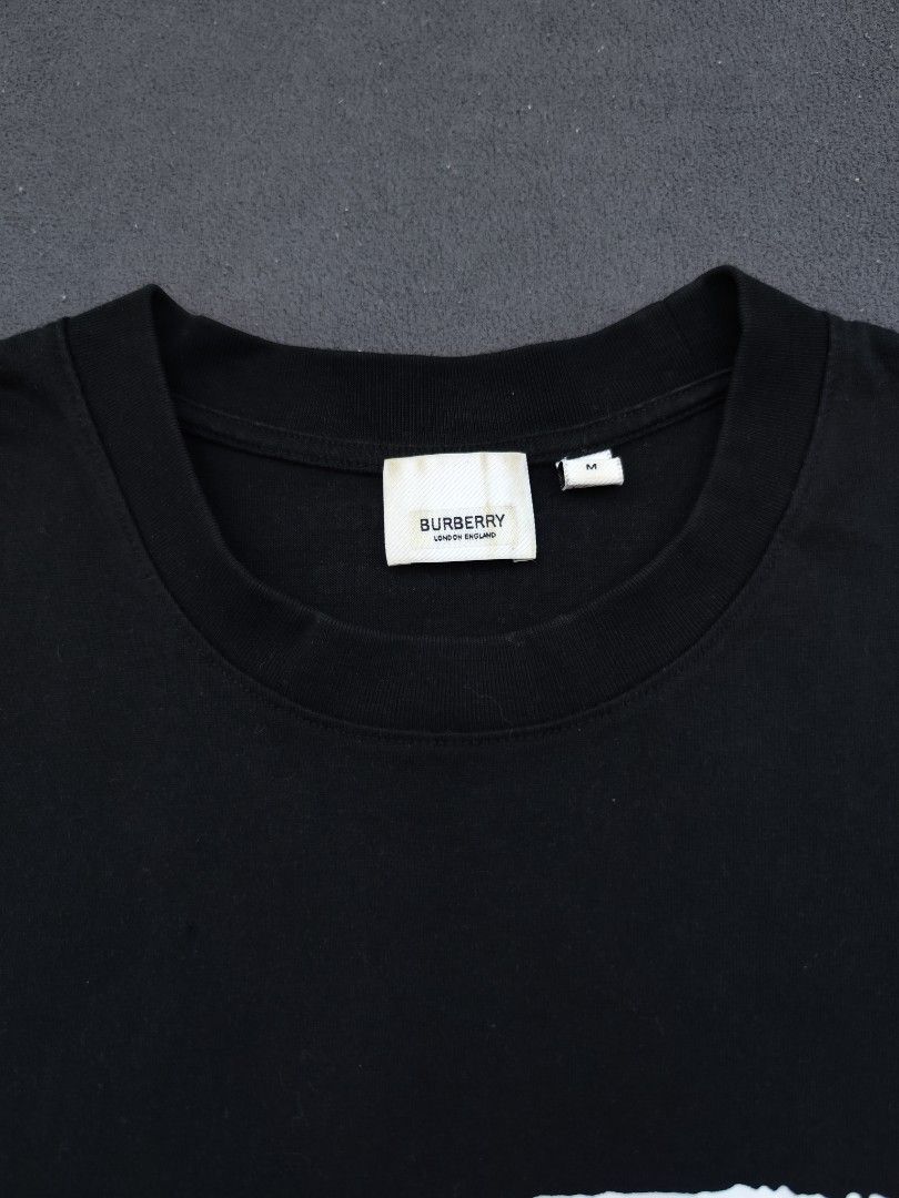Burberry Love Tee (Category: Luxury Apparel) located in Bulacan. Submitted by emilj23 (Listing ID 1469199059, Image 3). Description: Burberry Love Tee Size M on tag L 26 W 20 Condition 9/10 Color rate 9/10 Issue Print Stains,Pinhole.