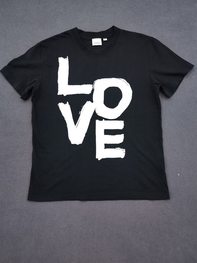 Burberry Love Tee (Category: Luxury Apparel) located in Bulacan. Submitted by emilj23 (Listing ID 1469199059, Image 1). Description: Burberry Love Tee Size M on tag L 26 W 20 Condition 9/10 Color rate 9/10 Issue Print Stains,Pinhole.