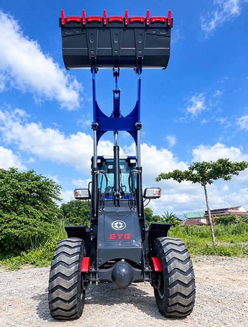 BYG LG949 Wheel Loader Heavy Equipment (Category: Industrial Equipment) located in Caloocan City. Submitted by princess1210_ (Listing ID 1469229270, Image 3). Description: - Model: BYG LG949 Wheel Loader - Color: Vibrant Blue - Condition: Clean body panels with clear branding - Features: Enclosed operator cabin, heavy tread tires, and rear counterweight - Performance: Powerful hydraulic arms with elevated front bucket - Application: Ideal for hea