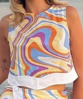 Calliope retro crop top (Category: Blouses) located in Manila. Submitted by esamd (Listing ID 1469319083, Image 3). Description: CALLIOPE Size: Small Colorful retro-swirl patterned sleeveless crop top.