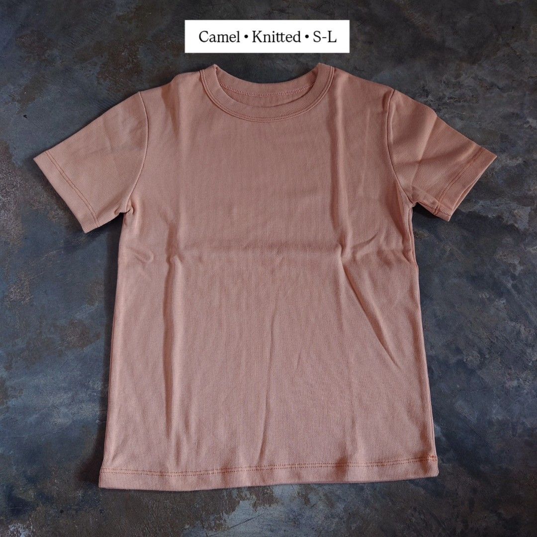 Camel Knitted Short Sleeve T-Shirt S-L (Category: Shirts) located in Diffun. Submitted by declutteredbyJill (Listing ID 1469234021, Image 1). Description: - Color: Classic camel - Material: Stretchable knitted ribbed fabric - Fit: Comfortably fits sizes S to L - Details: Crew neckline with ribbed collar, straight hem with double stitching - Style: Simple basic piece, perfect for everyday wear.