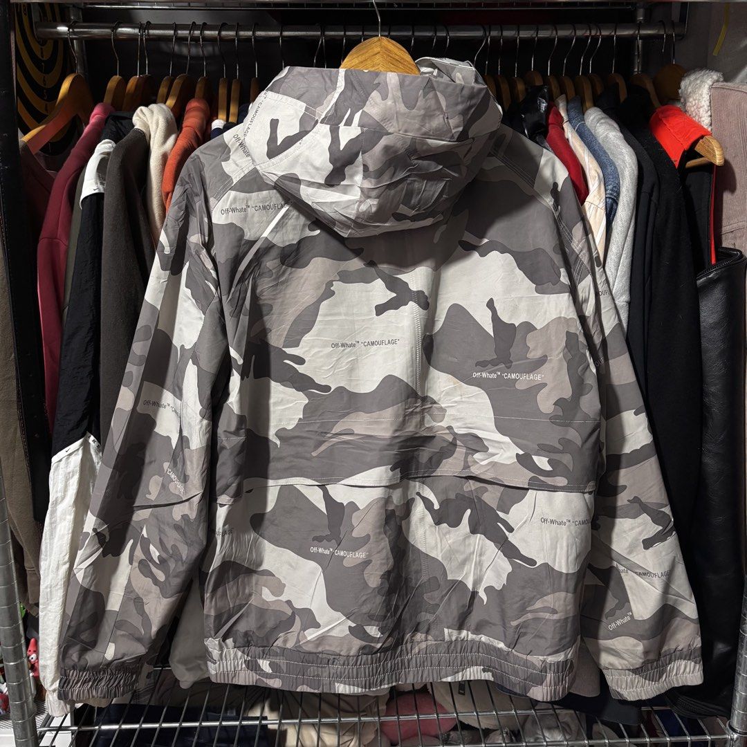 Camou Jacket With Hood And Complete Tags (Category: Coats, Jackets and Outerwear) located in Caloocan City. Submitted by bonsatocha43876 (Listing ID 1469321741, Image 2). Description: - Condition: Brand new with complete tags attached - Design: Stylish grey camouflage pattern - Fit: 22 inches width x 26 inches length - Closure: Full zip and button front closure - Pockets: Two front utility pockets with secure zip closures - Details: Elasticated c