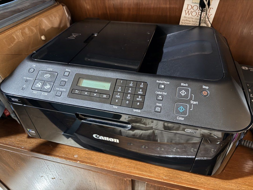 Canon MX416 Wireless All-In-One Printer (Category: Printers, Scanners & Copiers) located in Quezon City. Submitted by whd1220 (Listing ID 1469182765, Image 1). Description: - Model: Canon MX416 All-in-One Printer - Features: Built-in Wi-Fi, scanner, and fax capability - Design: Stylish black glossy finish with standard paper tray - Controls: Front panel with numeric keypad, LCD screen, and dedicated copy buttons - Condition: Powers on normally, p