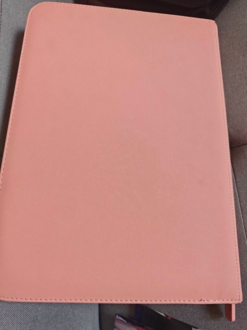 Card Guardian 9-pocket side loading binder for TCG (Category: Trading Cards Accessories) located in Quezon City. Submitted by minjusohee (Listing ID 1469335448, Image 3). Description: -9-pocket side loading -cubao location -1900 pesos used for a month only, inserted cards only once and not all slots have been used. still lots of unused slots. -rfs upgraded to 12-pocket binder -same quality as vaultx -pink on this is a rare color.